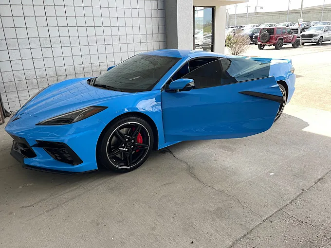 A blue Chevrolet Corvette with fresh window tint, a Totally Tinted job