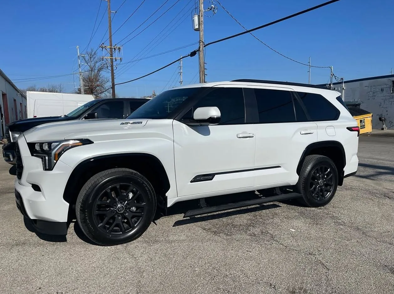 A white Toyota Sequoia with tinted windows, a Totally Tinted job